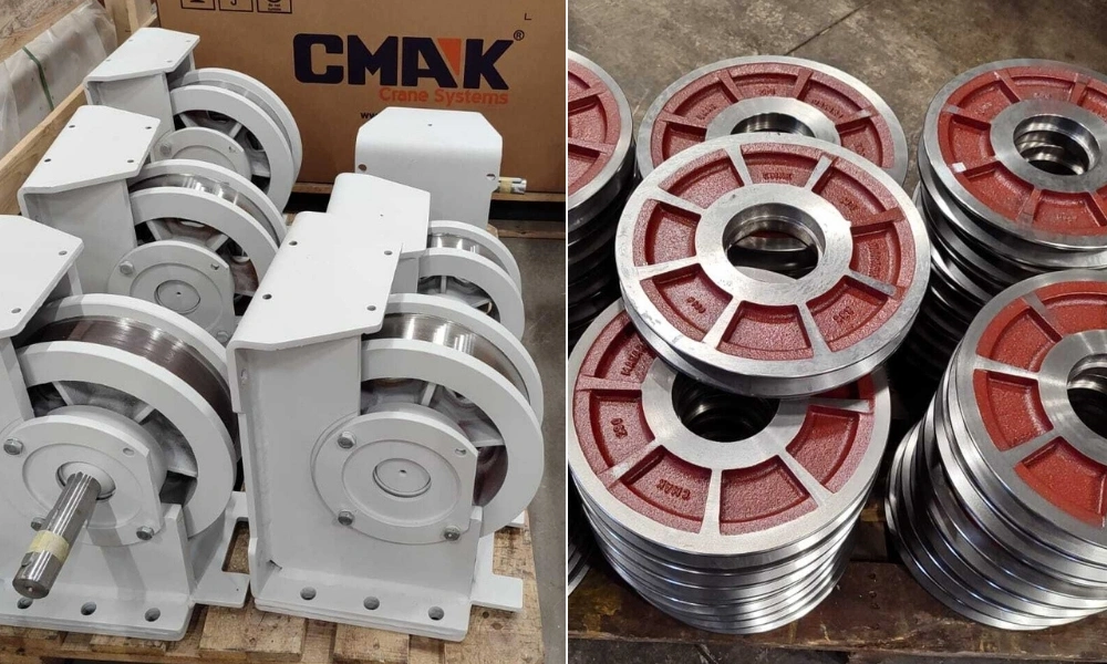 Cast iron crane wheels and assembled wheel blocks for end truck carriages CMAK, showing the internal bearing housings and spline shafts.
