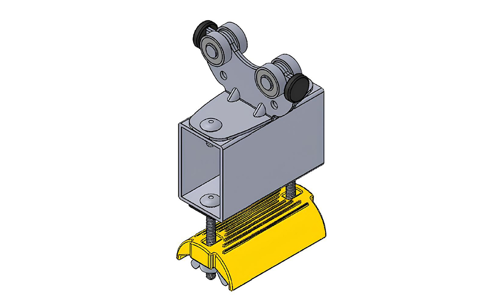 A 3D CAD model rendering of an intermediate trolley component used in C-track cable festoon systems, showing the metal roller bearings and yellow flat cable clamp saddle.