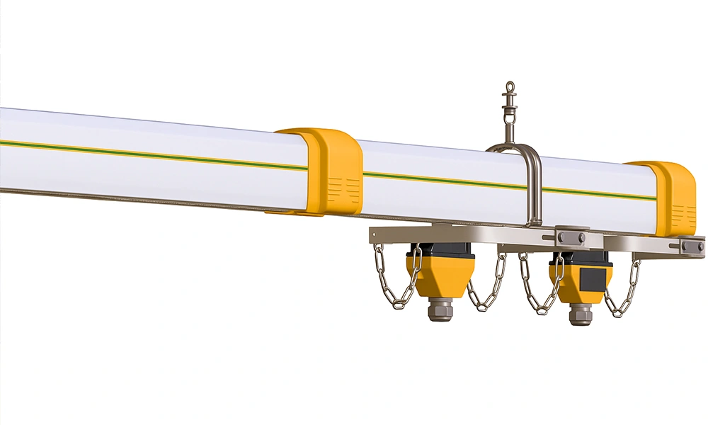 Profile view of a white insulated tracking profile with yellow joints from the PVC enclosed busbar systems line, shown with a dual current collector trolley assembly and towing chains mounted underneath.